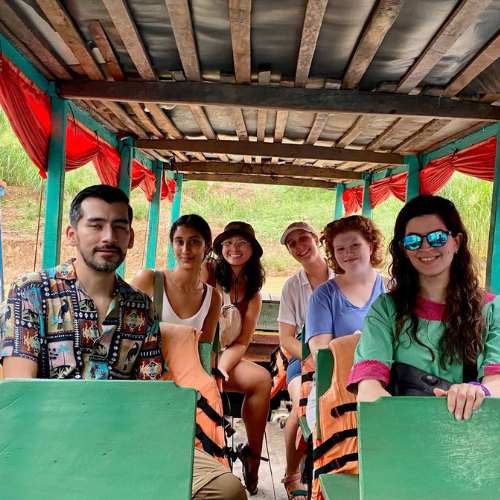 small group of travelers boarding on boat ready for 2-Day Angkor Wat Temple Sunset & Floating Village Tour by siemreapshuttle.com