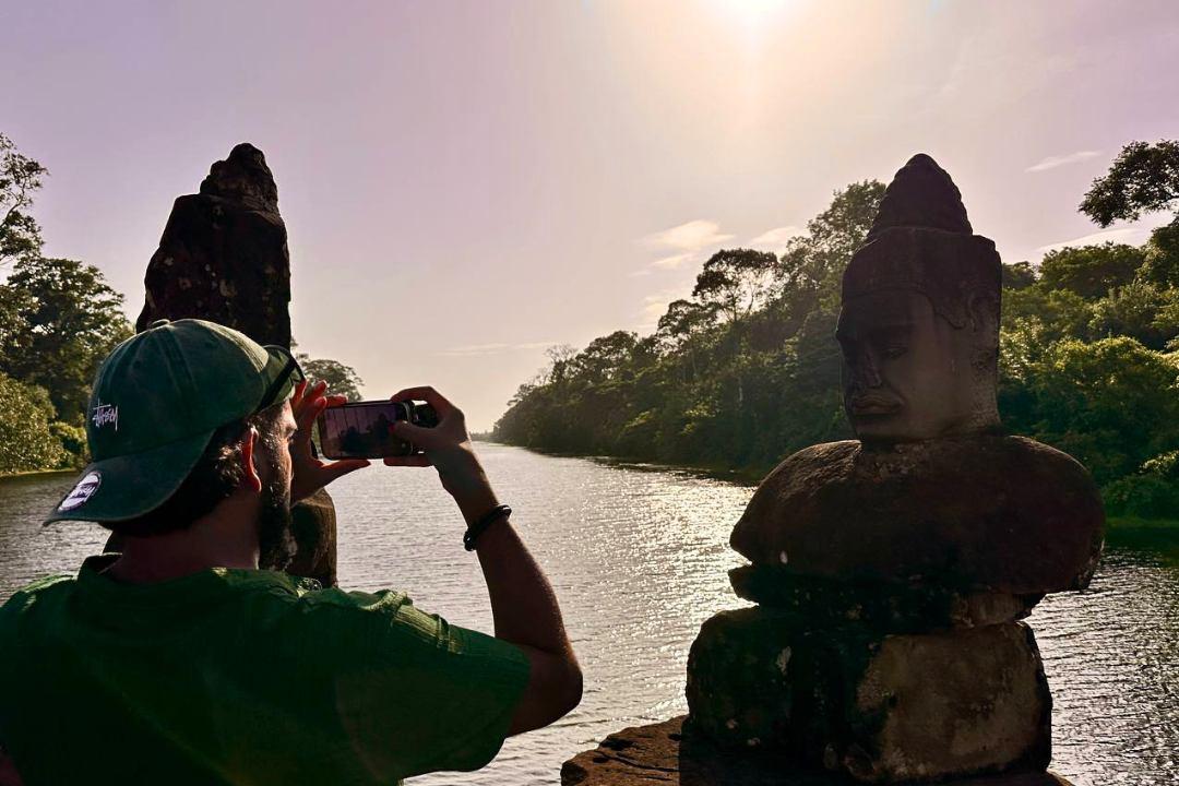 Best Angkor Wat Sunrise Small‑Group Tour gives you sunrise, Bayon, Ta Prohm, hotel pickup, a guide, and a done-by-lunch temple run that saves your first Siem Reap morning